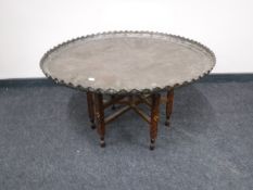 A large copper topped folding occasional table