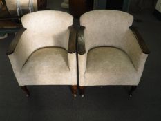 A pair of oak framed armchairs in oatmeal fabric