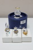 A Swarovski crystal cactus, together with three Swarovski Crystal Memories ornaments,