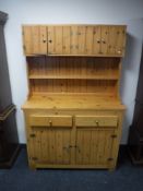 A farmhouse style pine dresser fitted with two drawers