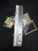 A knitting machine together with a box of accessories