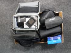 A box of assorted camera bags, Cannon EOS 650 with lens,