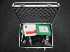 An aluminium camera case containing a Minolta X-300, Zenit EM camera,