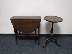 An antique mahogany Sutherland table and a wine table on tripod base