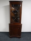 A mahogany corner display cabinet