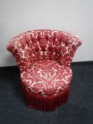 An early 20th century bedroom chair upholstered in floral fabric