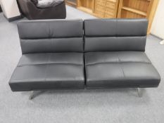 A contemporary black leather adjustable bed settee
