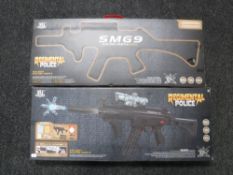 Two boxed Regimental police SMG water pellet rifles