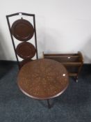 An Eastern tripod table with brass inlay,