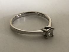 An 18ct white gold diamond solitaire ring, approximately 0.