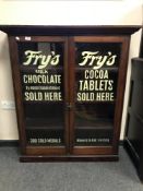 A Victorian and later stained pine bookcase 'Fry's Milk Chocolate'