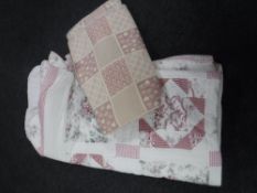 A bed quilt and a throw