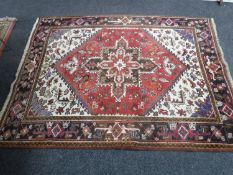 A fringed rug of Persian design CONDITION REPORT: Fringes reduced, selvedges intact.