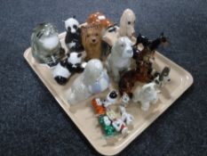 Three contemporary dragon figures together with a boxed globe desk clock and travel clock