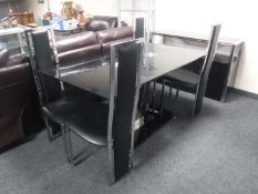 A six piece contemporary glass and metal dining room suite