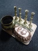 A tray of two pairs of brass candlestick, brass embossed planter, brass door handle,