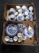Two boxes of blue and white willow pattern tea and dinner ware
