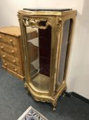 A gilt single door display cabinet with marble top,