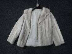 A fur coat CONDITION REPORT: Size unknown. In good condition.