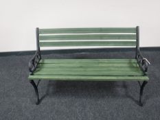 A wrought iron and wood garden bench