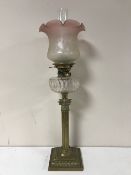 A Victorian glass oil lamp with clear glass reservoir CONDITION REPORT: Shade with