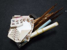 A box of two artists easels, quantity of unframed pictures,