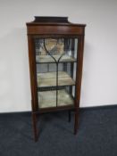 A Victorian inlaid mahogany display cabinet