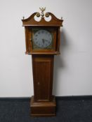 An oak case battery operated Granddaughter clock