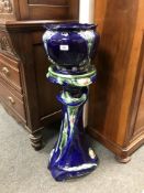 An Art Nouveau ceramic jardiniere on stand,