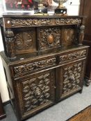 A 19th century heavily carved buffet backed sideboard,