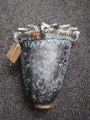 An Eastern style pottery vase with sunburst rim