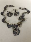 A silver necklace with matching earrings, with original purchased receipt dated 1987 £157.