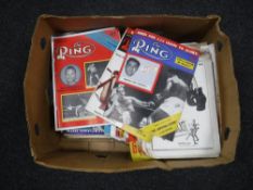 A box of vintage boxing magazines