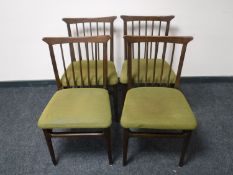 A set of four Danish teak rail back chairs