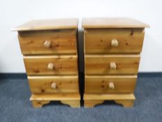 A pair pine three drawer beside chests
