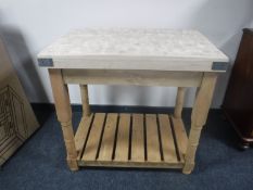 A reclaimed pine two tier butcher's block table