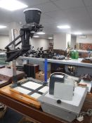 An Lietz Focomat enlarger on stand together with a transparency viewing box