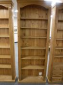 A set of pine open shelves,