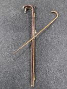 Five antique walking sticks (four with silver mounts)