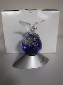 A boxed Swarovski crystal planet vision 2000