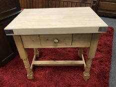 A reclaimed pine butcher's block fitted a drawer,