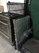 Two folding metal dog cages