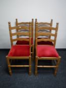 Four pine ladder back kitchen chairs