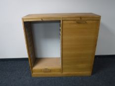 A mid 20th century double door shutter front cabinet