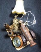 A tray containing a figural table lamp of a street seller, wooden cannon table lamp,