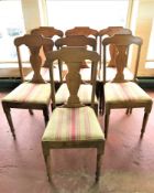 A set of seven oak dining chairs