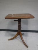A Victorian mahogany adjustable pedestal occasional table