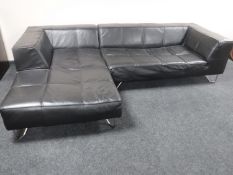 A Fenwicks Boconcept black leather L-shaped settee on metal legs