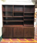 A pair of Danish bookshelves fitted cupboards beneath