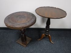 An antique mahogany pedestal wine table and a carved hardwood occasional table